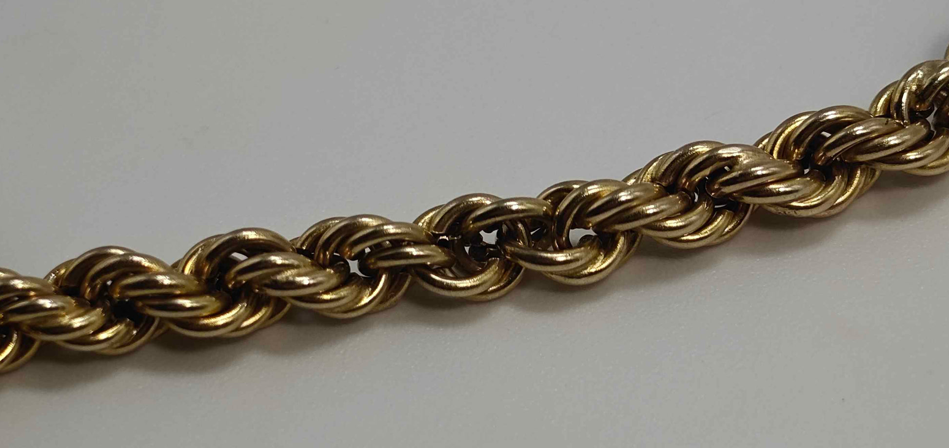 Gold chain on a white background